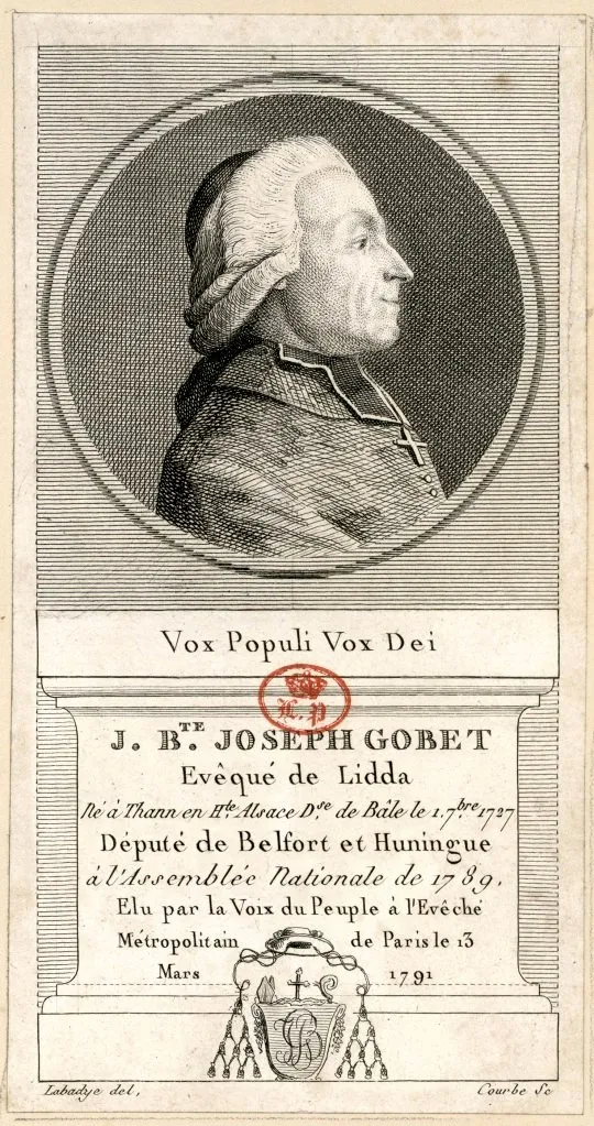 Gravure : portrait en médaillon de Jean-Baptiste Gobel de profil, en rochet, au-dessus de la devise « Vox populi vox Dei » et d’une légende rappelant son élection à l’évêché de Paris